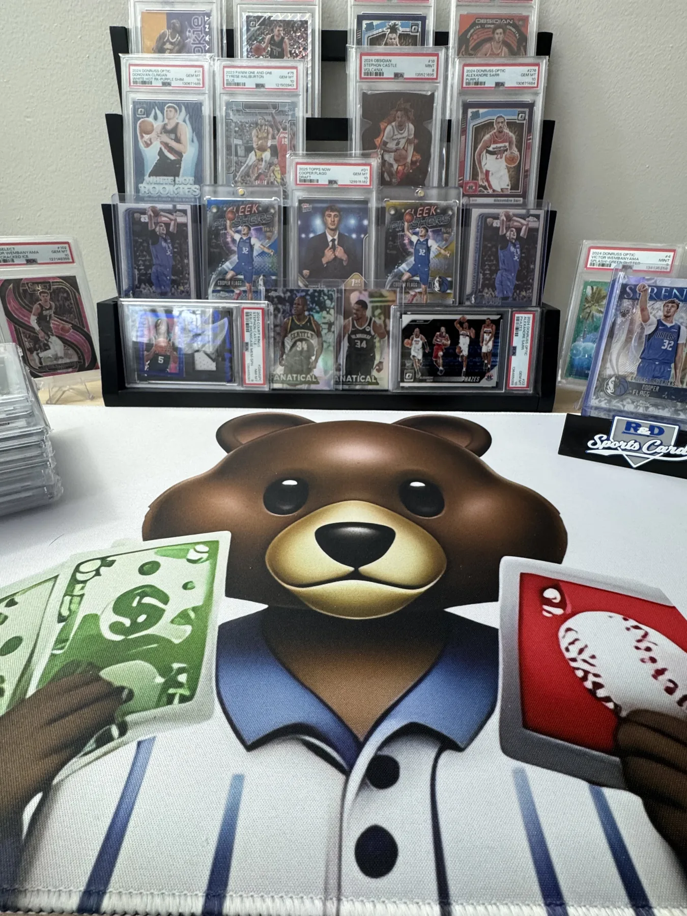 Eddie Bear Trading Cards display featuring PSA graded cards